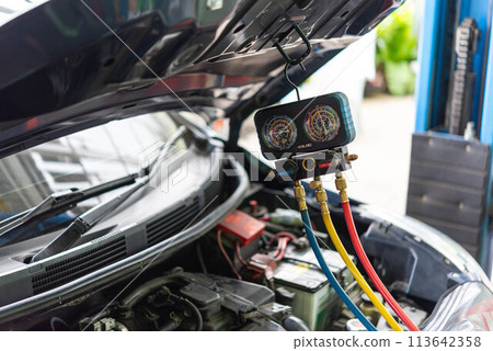 Car refilling air condition at car garage Car refilling air condition at car garage 113642358