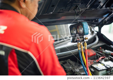 Car refilling air condition at car garage Car refilling air condition at car garage 113642397