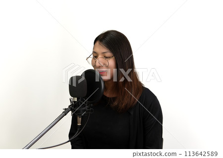 Woman (LGBTQ) singer sing a song with microphone 113642589
