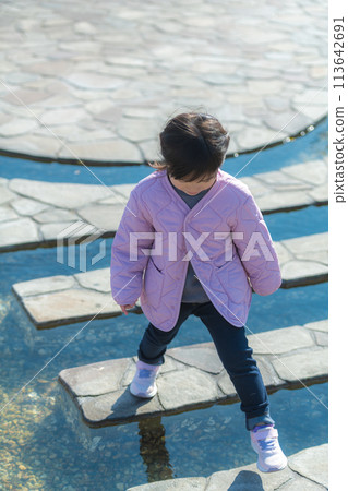 The girl playing in the park The girl playing in the park 113642691