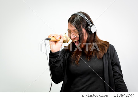 Woman (LGBTQ) singer sing a song with microphone 113642744