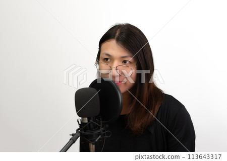 Woman (LGBTQ) singer sing a song with microphone 113643317