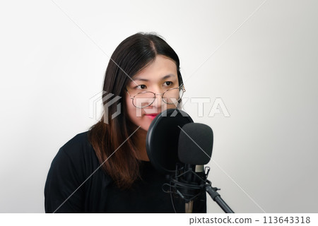 Woman (LGBTQ) singer sing a song with microphone 113643318