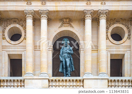 A statue of Napoleon stands prominently in a niche at Les Invalides, Paris, framed by ornate architecture A statue of Napoleon stands prominently in a niche at Les Invalides, Paris, framed by ornate architecture 113643831