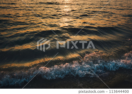 Sunset at Railay Beach with orange lights 113644400