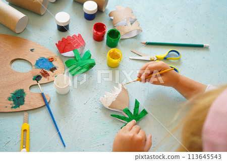 Kids craft flowers out of recycling toilet paper roll, zero waste concept. Step by step tutorial - 4. 113645543