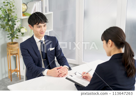 Businessman being interviewed 113647263