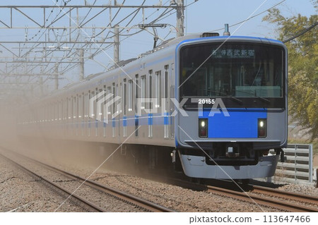 Seibu 20000 series train running through the dust on the Seibu Shinjuku Line Seibu 20000 series train running through the dust on the Seibu Shinjuku Line 113647466