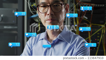Image of falling icons and network of connections over biracial male server room worker 113647910
