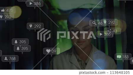 Image of falling icons over caucasian female server room worker Image of falling icons over caucasian female server room worker 113648105