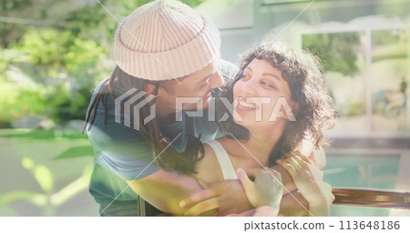 Image of grass over biracial man and disabled woman sitting in wheelchair 113648186