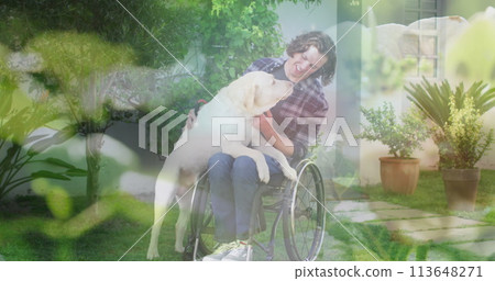 Image of grass over disabled caucasian man sitting in wheelchair with his dog 113648271