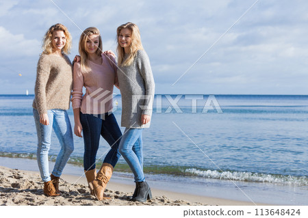 Three fashionable sister on the beach Three fashionable sister on the beach 113648424