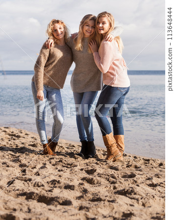Three fashionable sister on the beach 113648444