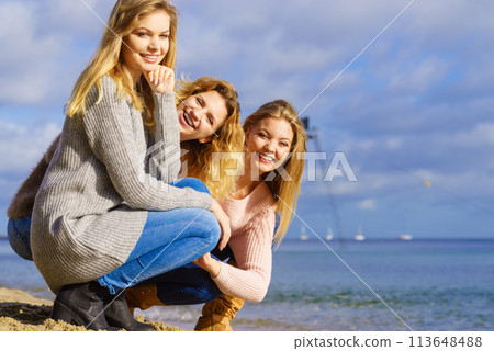 Three fashionable models outdoor 113648488