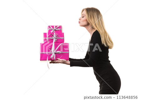 Girl holding stack of pink gift boxes Girl holding stack of pink gift boxes 113648856