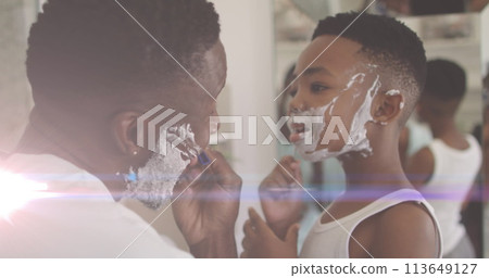 Image of lights over happy african american father and son shaving beards 113649127