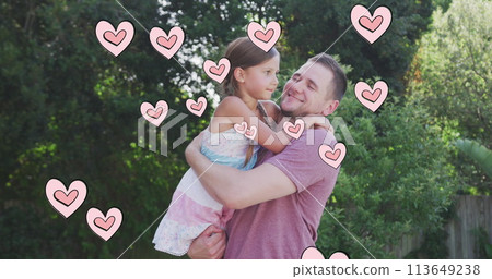 Image of hearts over caucasian father hugging his daughter in garden Image of hearts over caucasian father hugging his daughter in garden 113649238