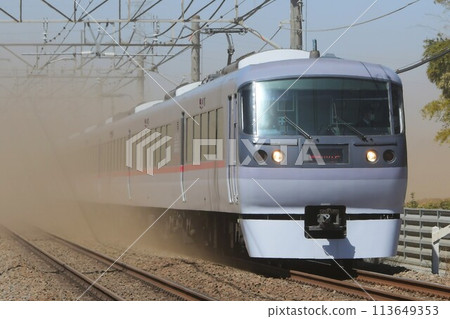 Seibu 10000 Series NRA New Red Arrow Express Koedo Train running through the dust on the Seibu Shinjuku Line Seibu 10000 Series NRA New Red Arrow Express Koedo Train running through the dust on the Seibu Shinjuku Line 113649353
