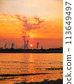 Factory illuminated by the setting sun 113649497