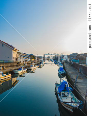 Fishing port with fishing boats in the early morning 113649501