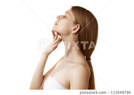 Side view photo of young woman massaging her neck and chin to prevent double chin against white studio background. 113649790