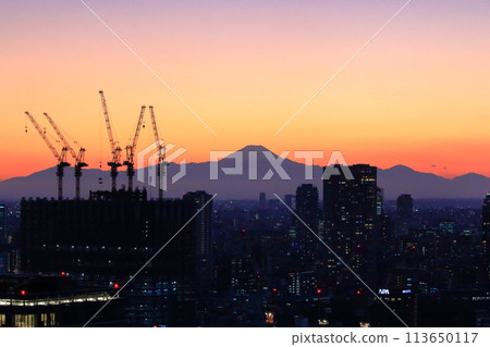 Sunset behind Mt. Fuji as seen from Minato-ku in central Tokyo Japan Sunset behind Mt. Fuji as seen from Minato-ku in central Tokyo Japan 113650117