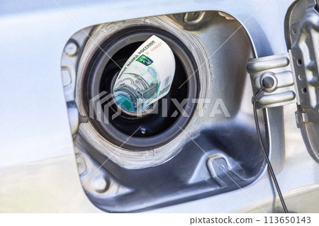 Russian roubles banknotes in the gas tank of a vehicle Russian roubles banknotes in the gas tank of a vehicle 113650143