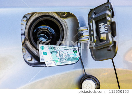 Russian roubles banknotes in the gas tank of a vehicle Russian roubles banknotes in the gas tank of a vehicle 113650163