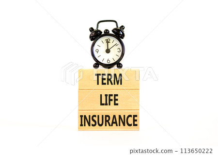 Term life insurance symbol. Concept words Term life insurance on beautiful wooden blocks. Beautiful white table white background. Black alarm clock. Medical term life insurance concept. Copy space. 113650222
