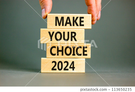 Make your choice 2024 symbol. Concept words Make your choice 2024 on beautiful wooden block. Beautiful grey table grey background. Voter hand. Business Make your choice 2024 concept. Copy space. 113650235