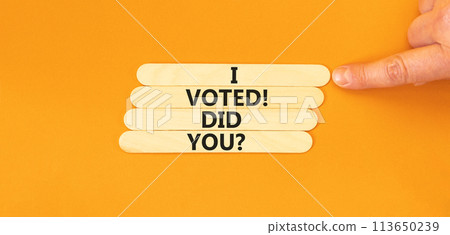 I voted. Did you symbol. Concept words I voted. Did you on wooden stick. Beautiful orange table orange background. Voter hand. Business I voted. Did you concept. Copy space. 113650239