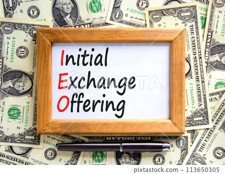 IEO initial exchange offering symbol. Concept words IEO initial exchange offering on beautiful wooden frame. Beautiful dollar background. Business IEO initial exchange offering concept. Copy space. IEO initial exchange offering symbol. Concept words IEO initial exchange offering on beautiful wooden frame. Beautiful dollar background. Business IEO initial exchange offering concept. Copy space. 113650305