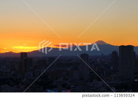 Sunset behind Mt. Fuji as seen from Minato-ku in central Tokyo Japan Sunset behind Mt. Fuji as seen from Minato-ku in central Tokyo Japan 113650324