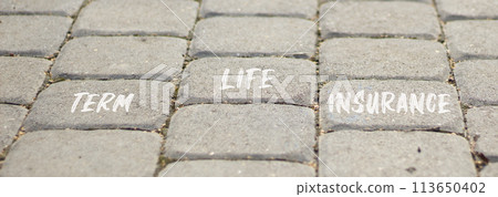 Term life insurance symbol. Concept words Term life insurance on beautiful grey paving slabs. Beautiful grey paving slabs background. Medical term life insurance concept. Copy space. 113650402