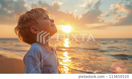 Little boy enjoying summer against the sky Little boy enjoying summer against the sky 113650520
