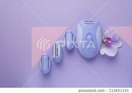 top view of Modern epilator on purple background. skin care, removal of unwanted hair. 113651191