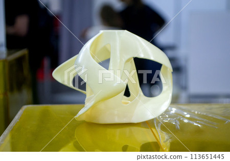 3D printed object from resin polymerization. Parts created on 3D printer from hardened resin. Details printed on 3D printer using SLA printing technology. New modern additive 3D printing technologies 113651445