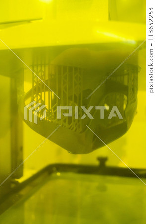 Process SLA 3D printing. Process printing on 3D printer by SLA printing technology. 3D printed object from resin polymerization. Object created on 3D printer from hardened resin. Printing technology 113652253