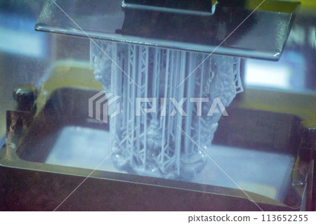 Process SLA 3D printing. Process printing on 3D printer by SLA printing technology. 3D printed object from resin polymerization. Object created on 3D printer from hardened resin. Printing technology 113652255