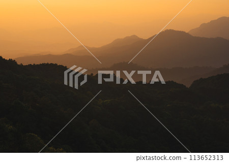 nature traveling with orange sky and layer of mountain with sunrise background nature traveling with orange sky and layer of mountain with sunrise background 113652313
