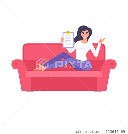 Happy brunette woman holding clipboard to do list with checkmarks tasks completed sitting on couch 113652469