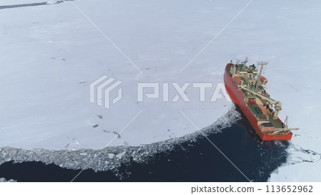Antarctica Icebreaker Ship Break Through Ice. . Laurence M. Gould Research Boat Travel Frozen Southern Ocean Glacier Field at Continent Coast Top Aerial Drone 113652962
