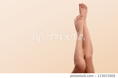 Beautiful well-groomed women's legs close-up on a Beautiful well-groomed women's legs close-up on a 113653808