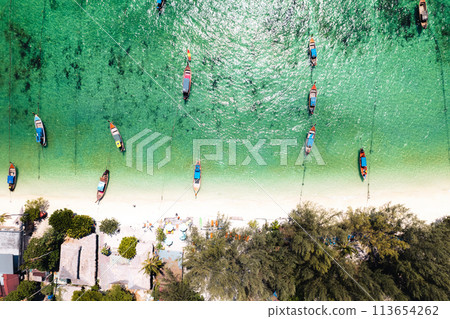 Aerial view of longtail boat and beach at Koh Lipe. 113654262