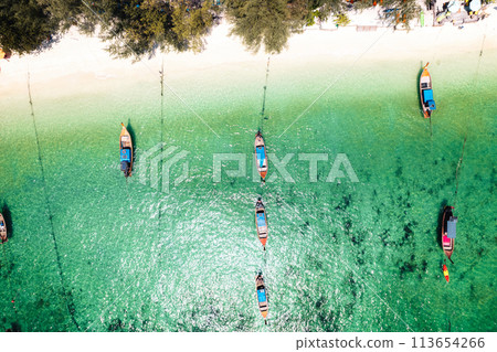 Aerial view of longtail boat and beach at Koh Lipe. Aerial view of longtail boat and beach at Koh Lipe. 113654266