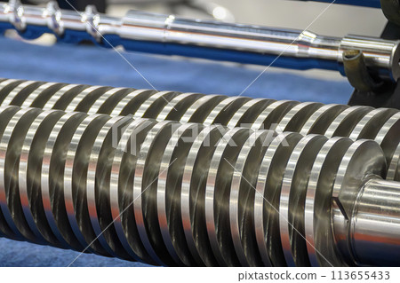 Close up scene group of the barrel screw of injection machine spare parts. Close up scene group of the barrel screw of injection machine spare parts. 113655433
