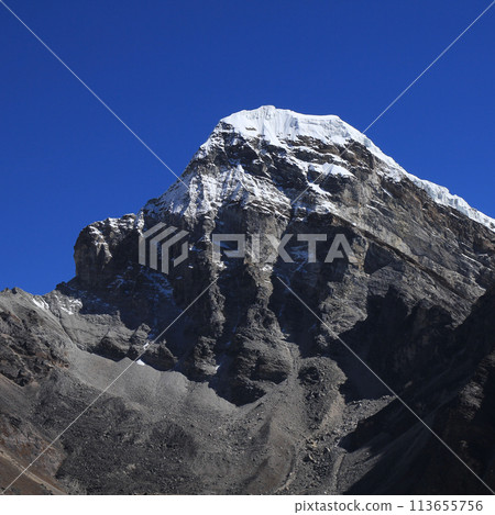 Azure blue sky over a peak near Gokyo, Nepal. 113655756