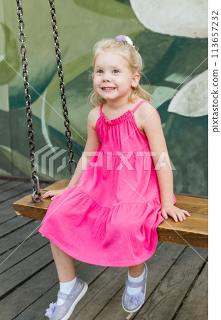 Child walks with cochlear implant system. Installation cochlear implant on child girl ear for restores hearing. Kid hears after hear return to normal. Diversity inclusion concept. 113657232