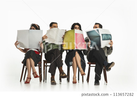 Group of four people, men and women in retro-style clothes sitting on chair and reading newspapers, journals on white background. Group of four people, men and women in retro-style clothes sitting on chair and reading newspapers, journals on white background. 113657282